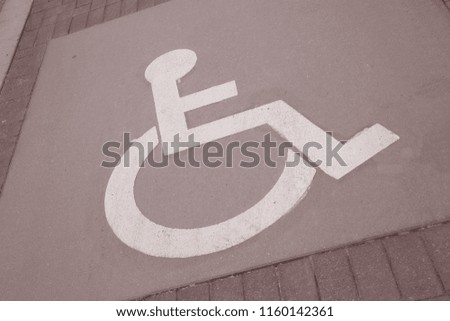 Disabled Parking Sign in Urban Setting in Black and White Sepia Tone