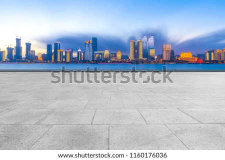 Qingdao city skyscrapers with empty square floor tiles