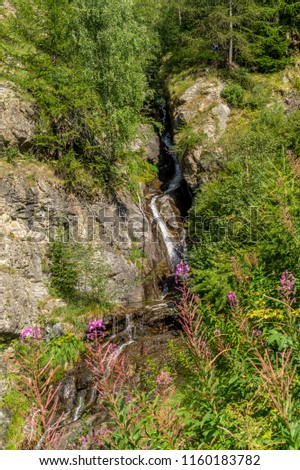 waterfall in the mountains among the rocks