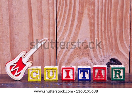 LetterBlock In Word Guitar wood Background