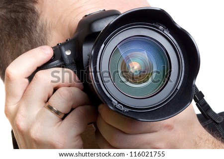 Photographer taking pictures with digital camera over white background