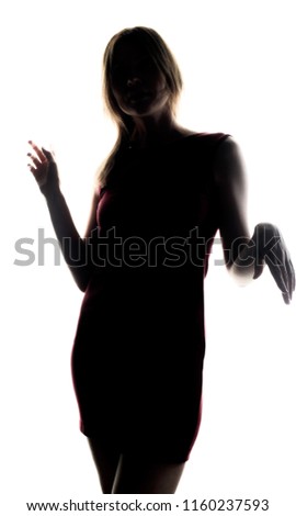 silhouette of a girl who stands in a pensive posture