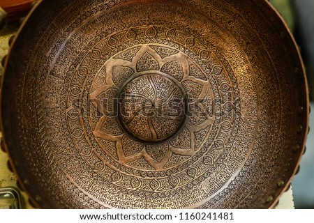 Antique Middle East hand craft bowl with Arabic / Turkish / Persian typography. made from metal Cooper. golden color bowl used as fortune tellers tool. islamic culture. iran turkey arabs culture.