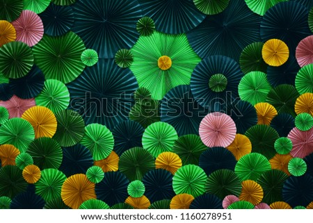 Green and yellow and pink papers circle shape of origami for ideas of love with copy space. Or any other abstract background paper designs, sheets of paper, lined paper.