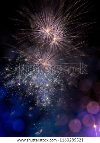 Light purple, pink and blue firework. Amazing fireworks with bokeh from drops on the lens, fireworks 2019, fireworks background, fireworks event, Celebration in the town. Royalty-Free Stock Photo #1160285521