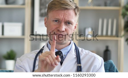 No, Rejecting Serious Confident Doctor by Waving Finger