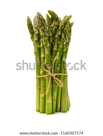 Fresh green asparagus on white Royalty-Free Stock Photo #1160307574