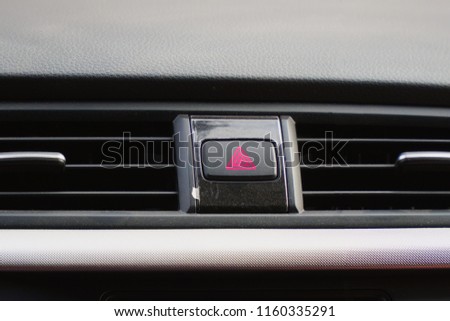 Emergency button on the car panel. Alarm button in the car