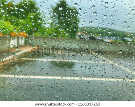 Rain drops on the window glass raining day