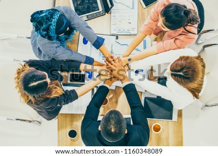 Beautiful Business People Join Hand Together. Cross Processing of Smart People Indoors. Team Work Concept. Successful Business People Teamwork Collaboration Relation Concept. Top View.