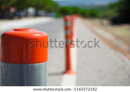traffic warning cone in row to separate route in road area