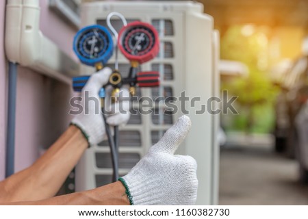 Close up of Air Conditioning Repair, repairman on the floor fixing air conditioning system Royalty-Free Stock Photo #1160382730
