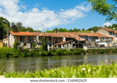 Houses near the hill on the Salat river in France.