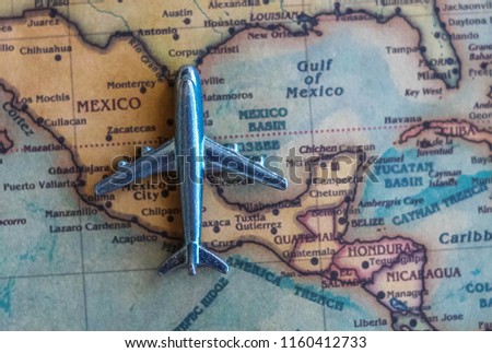 Plane model on Mexico part of world map. Flights/ travel in Mexico concept.