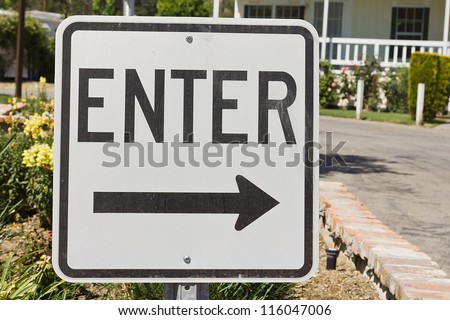 Road sign helps give which way to enter.