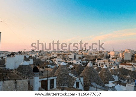 View of Alberobello with trulli roofs and terraces, Apulia region, Southern Italy. Famous Italian landmark. Typical village
