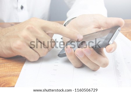 

Business image - a businessman using a smartphone