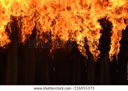 Burning wooden house close-up