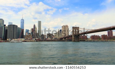 Manhattan financial district with skyscrapers and Brooklyn Bridge. Panoramic view of New York.