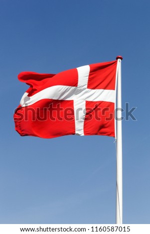 Flag of Denmark waving in the sky