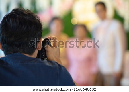 wedding photographer in action.  wedding photography takes pictures of the bride and groom. selective focus.