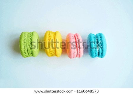 Colorful macaroons on gray background with copy space