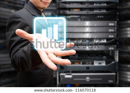 Programmer with Graph icon in server room