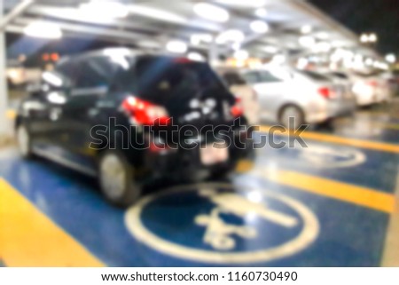 Blurred images of disabled parking spaces at night.