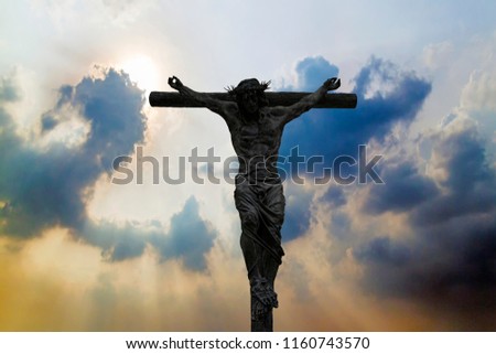 Silhouette of Jesus Christ crucifix cross on heaven
