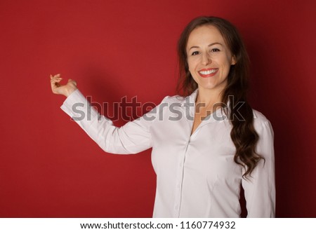 Beautiful woman showing / presenting something on the palm of her hand