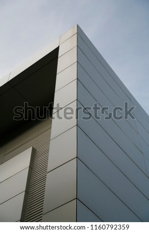 steel wall of modern trade center over the blue sky