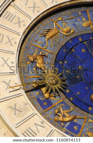 Ancient time, astrology and horoscope. Detail of St Mark Square old Clocktower with autumn and winter: zodiac signs Scorpio, Sagittarius, Capricorn, Aquarius, Libra, planets and stars (15th century)