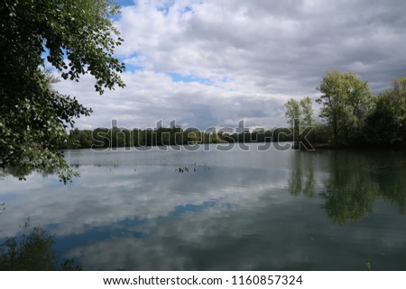 Photography of a lake near the city of Macon, France