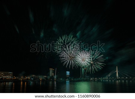 Magnificent fireworks over the River Daugava. Riga, Latvia. Long exposure. Copy space. 
