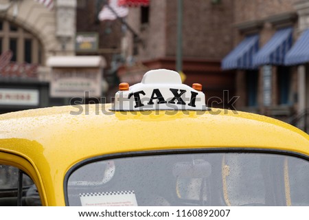 The Label of pulic Taxi on yellow car roof Royalty-Free Stock Photo #1160892007