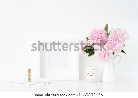 Summer white square blank poster mockup. Still life composition, cute bouquet of pink peonies in jug, gold stamp and con. Background, mock up for quote, promotion, headline, design