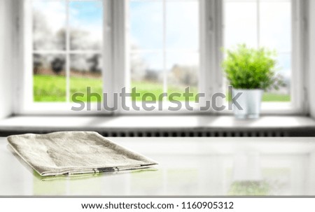 Desk of free space with background of window and napkin 