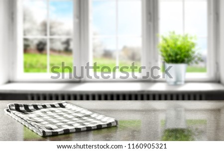 Desk of free space with background of window and napkin 