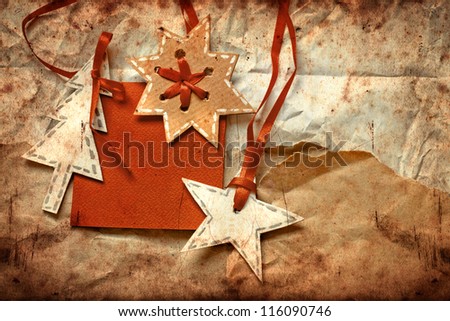 Christmas decoration over grunge paper background/old paper bordering with christmas decoration