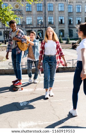 group of teenagers having fun together after school