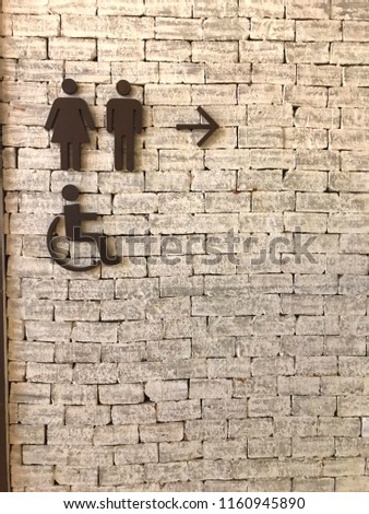 Surface of white brick wall and toilet
