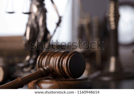 Law and justice concept. Statue of justice, judge's gavel, books, scales.