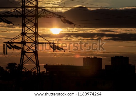 Orange sunset over a modern city. Energy Paints
