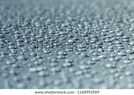 water drops on the polished surface of the car