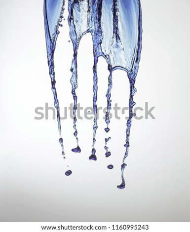 Clear, transparent blue water curtain splash on gray background