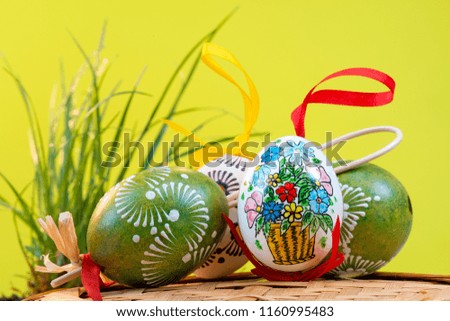 Painted Easter eggs on the yellow background