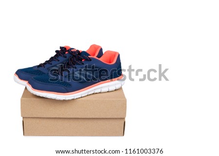 Female blue sport shoes with box isolated on white background, copy space template.