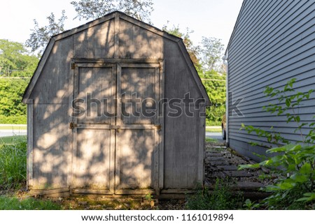 White Shed Next to House