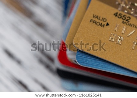 Stack of multicolored credit cards close-up 