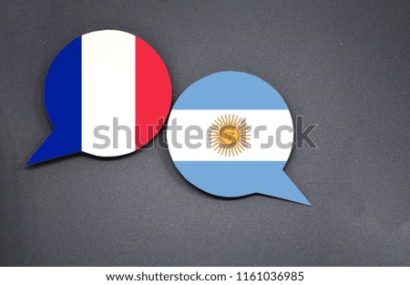 France and Argentina flags with two speech bubbles on dark gray background